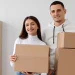 couple is looking ready with some cardboard boxes
